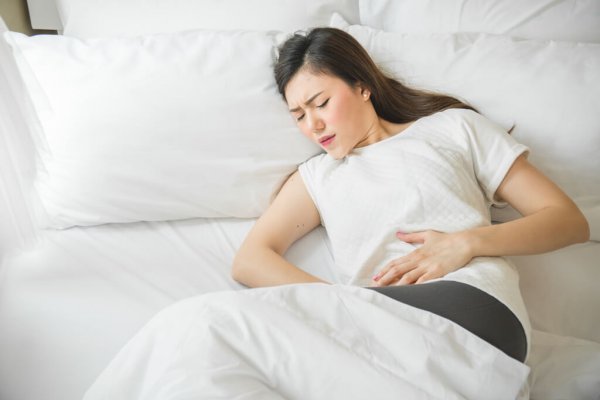 Asian,Woman,Have,A,Stomachache,In,Bedroom,Because,Menstruation